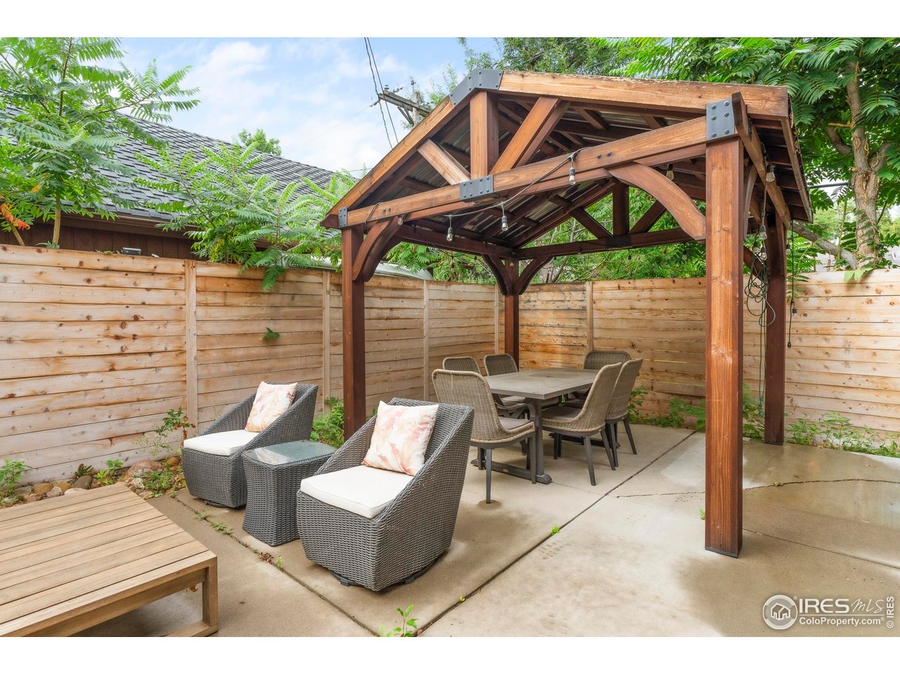2589 Alkire Street Golden, CO 80401 - Photo 48 of 50 a view of a patio with table and chairs under an umbrella