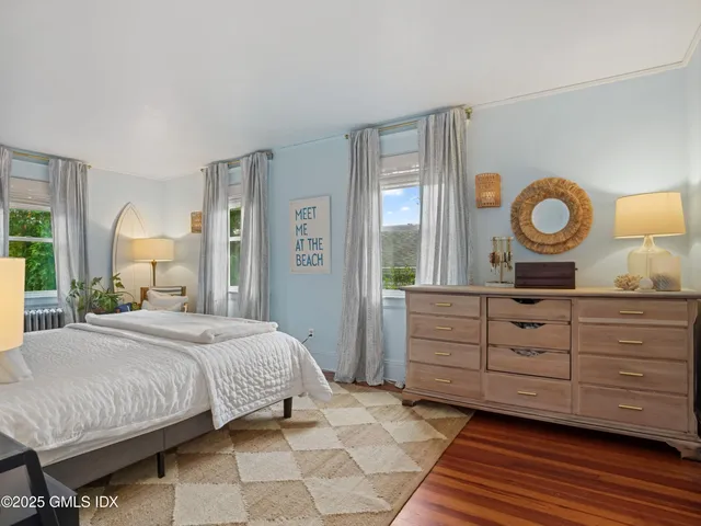a bathroom with a bathtub and window