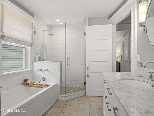 a bedroom with a bed and a night stand