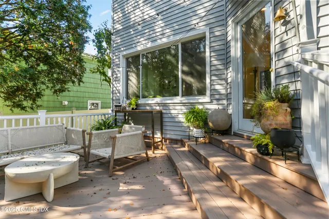 a view of a balcony with furniture