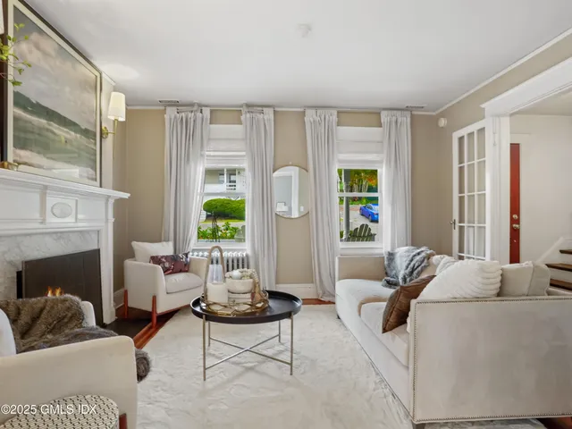 a living room with furniture and a table