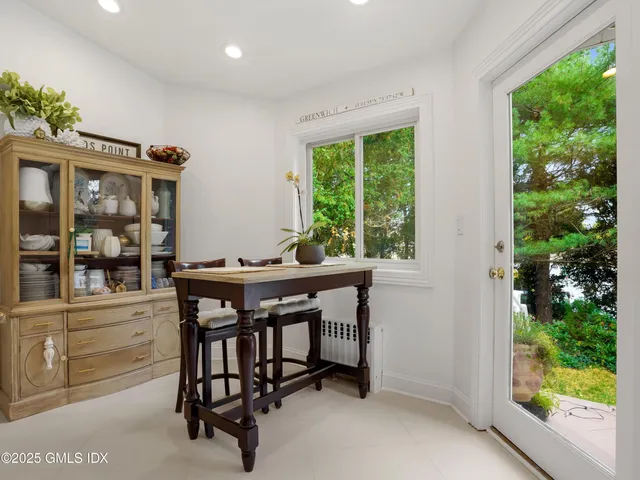 a view of workspace with wooden floor windows