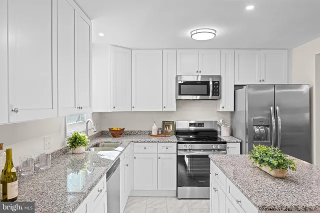 a kitchen with sink and window