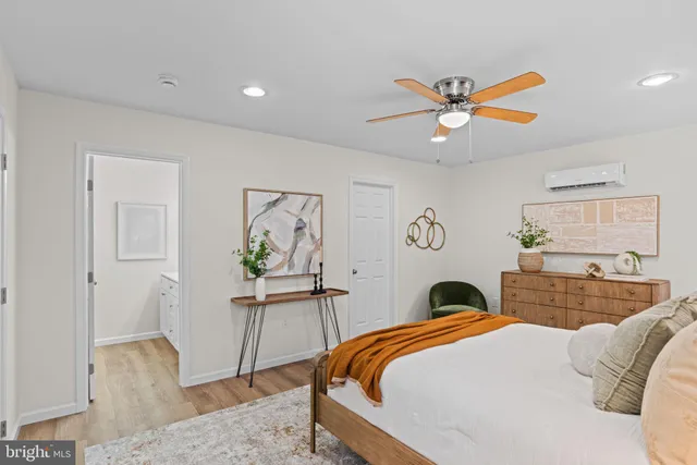 a bathroom with a shower a mirror and a sink