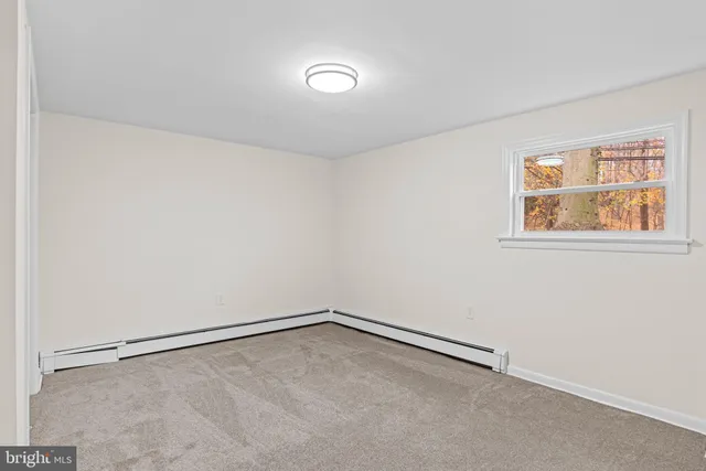 a living room with furniture kitchen and a table