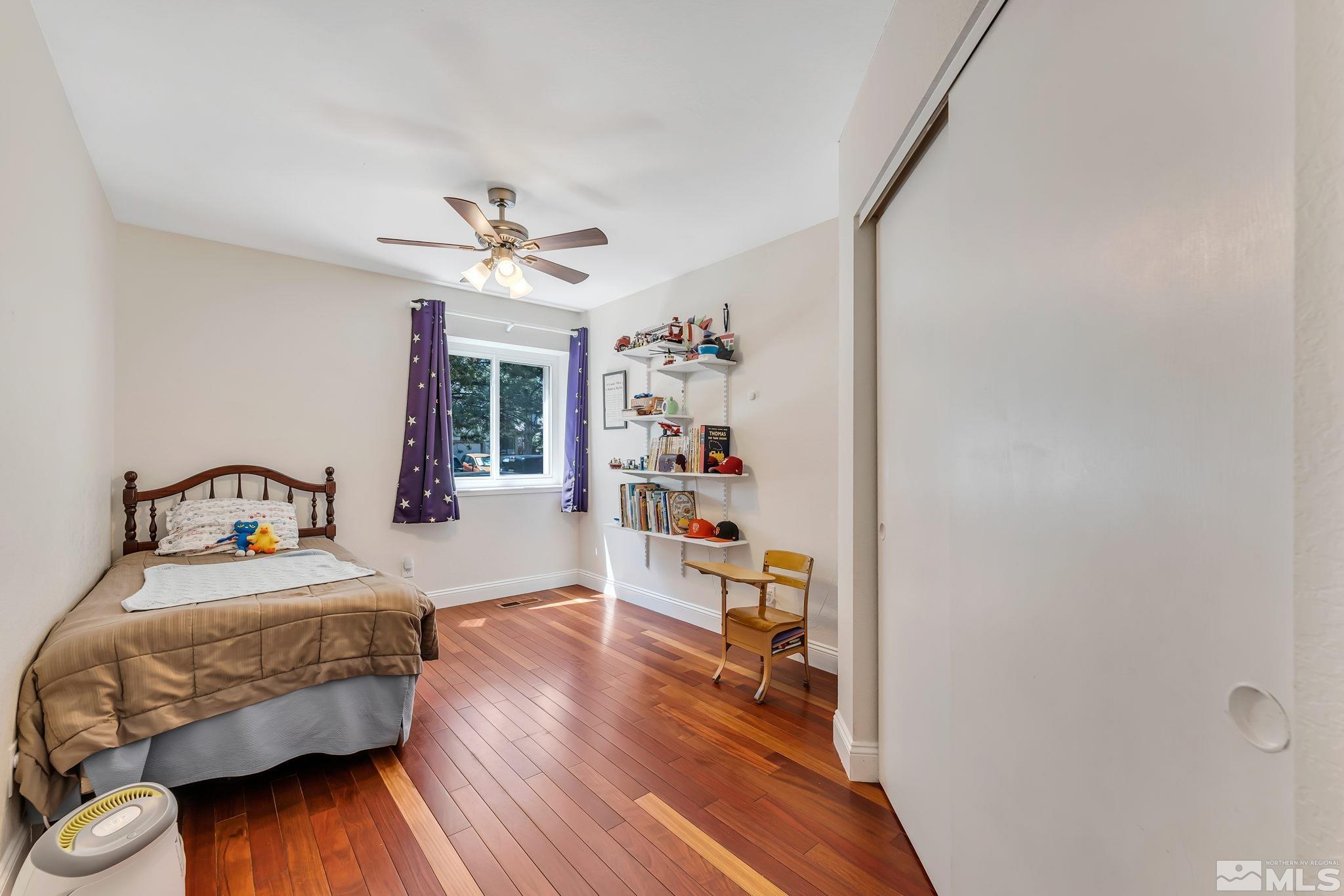 1802 Grand Point Way Reno, NV 89523 - Photo 12 of 19 a bedroom with a bed and wooden floor