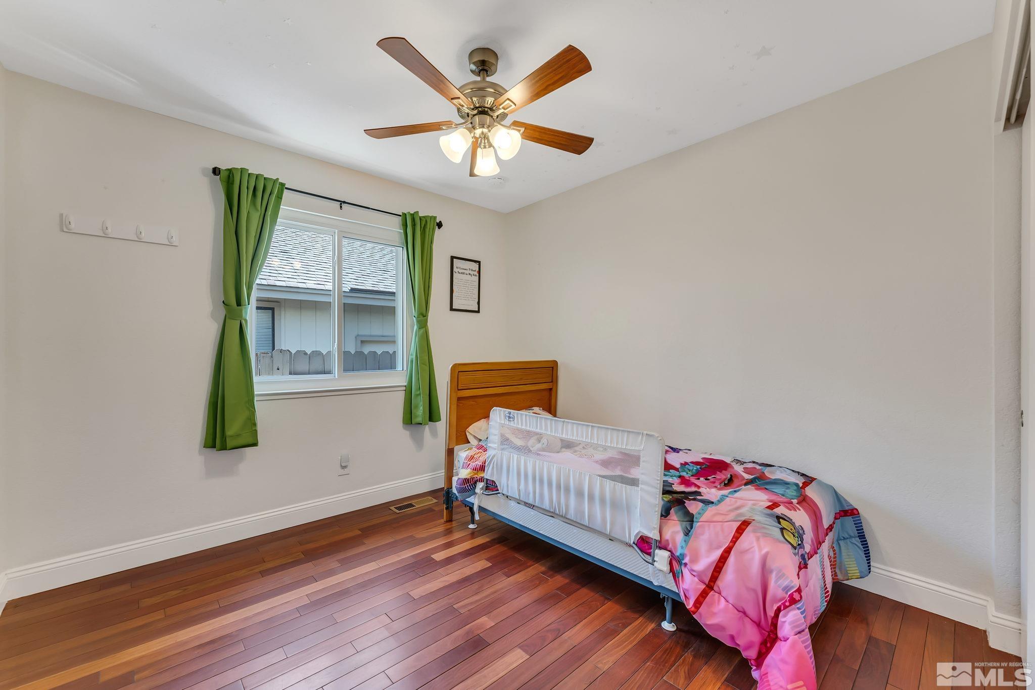 1802 Grand Point Way Reno, NV 89523 - Photo 14 of 19 a bedroom with a bed and a window