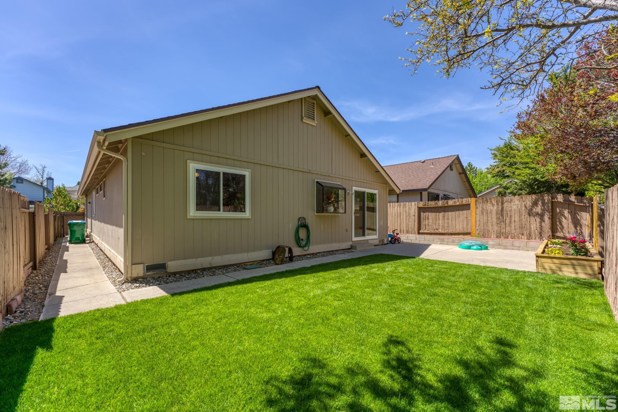 1802 Grand Point Way Reno, NV 89523 - Photo 17 of 19 a backyard of a house with table and chairs