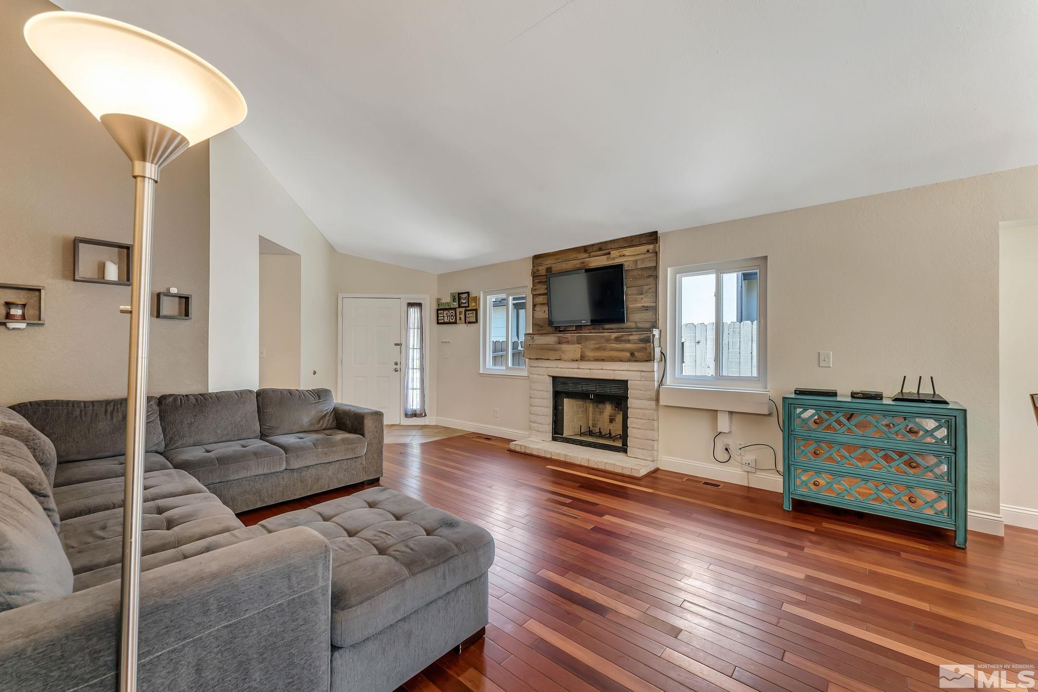 1802 Grand Point Way Reno, NV 89523 - Photo 3 of 19 a living room with furniture and a fireplace