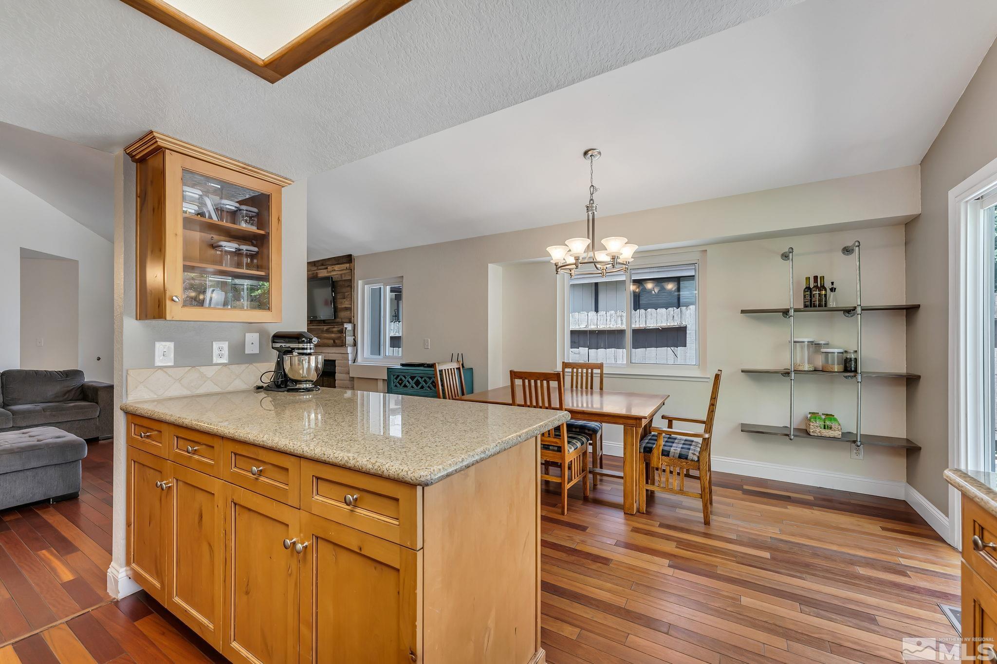 1802 Grand Point Way Reno, NV 89523 - Photo 7 of 19 a view of a kitchen wooden floor and dining table