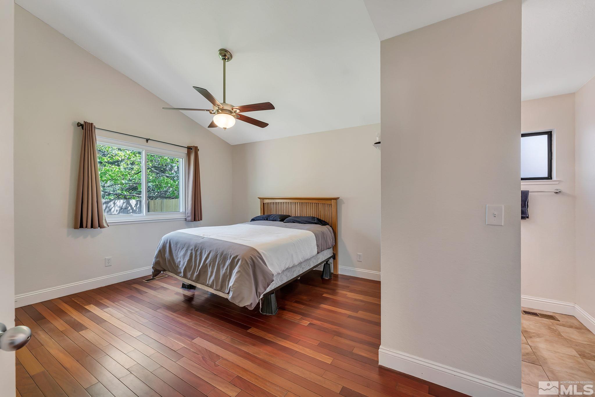 1802 Grand Point Way Reno, NV 89523 - Photo 9 of 19 a bedroom with a bed and a window