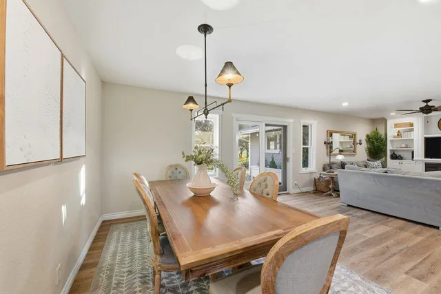 a view of a workspace with furniture and wooden floor