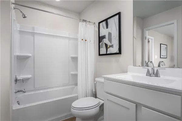 a bathroom with a sink a toilet and a bathtub
