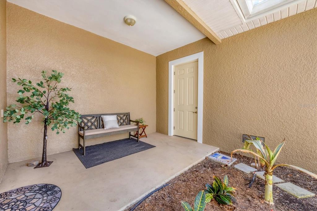 10720 Lemon Creek Loop, Unit 103 Englewood, FL 34224 - Photo 4 of 50 a bedroom with a bed and a potted plant