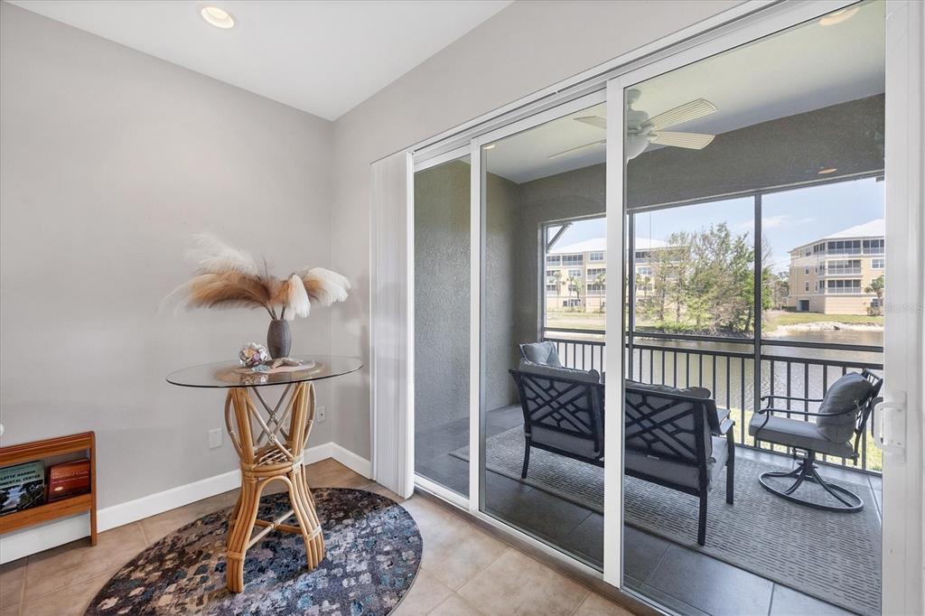10720 Lemon Creek Loop, Unit 103 Englewood, FL 34224 - Photo 7 of 50 a view of entryway with wooden floor and windows