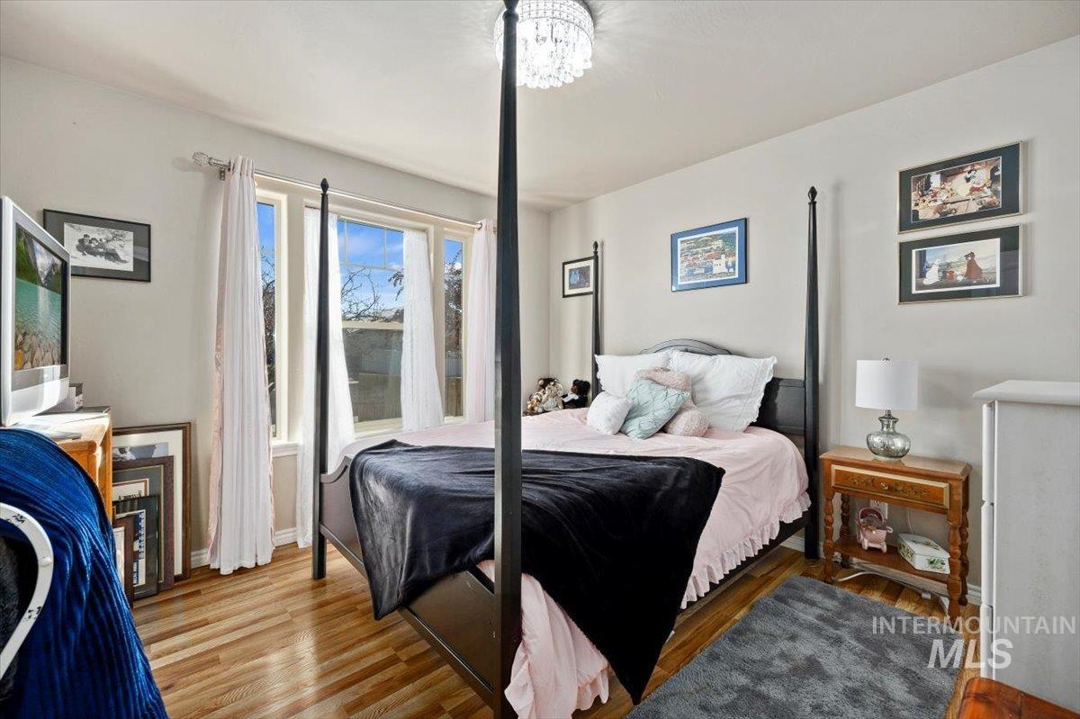 657 Creekside Way Twin Falls, ID 83301 - Photo 29 of 45 Bedroom featuring wood finished floors and baseboards