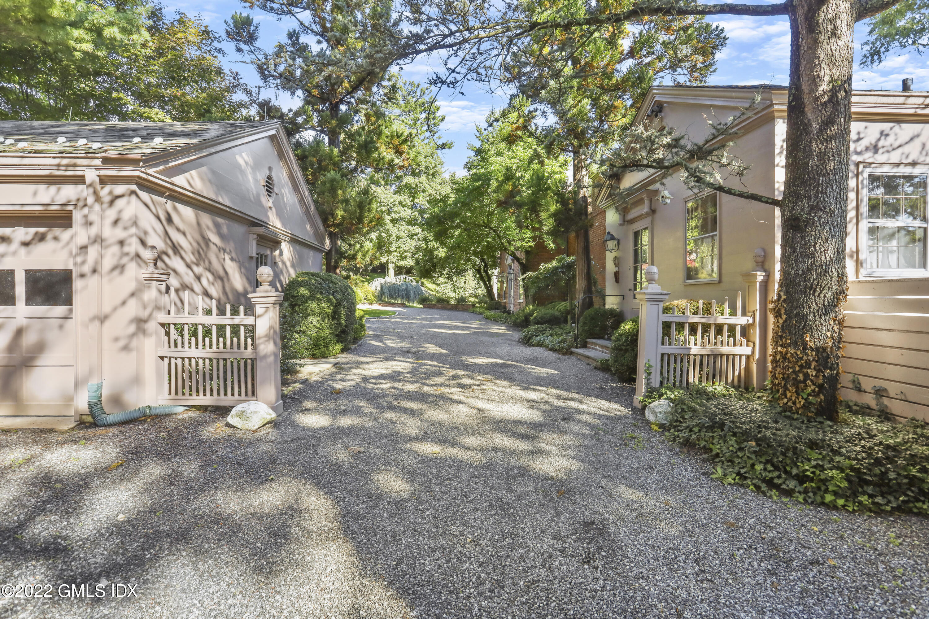 40 Doubling Road Greenwich, CT 06830 - Photo 15 of 21 a view of a house with a yard and large tree