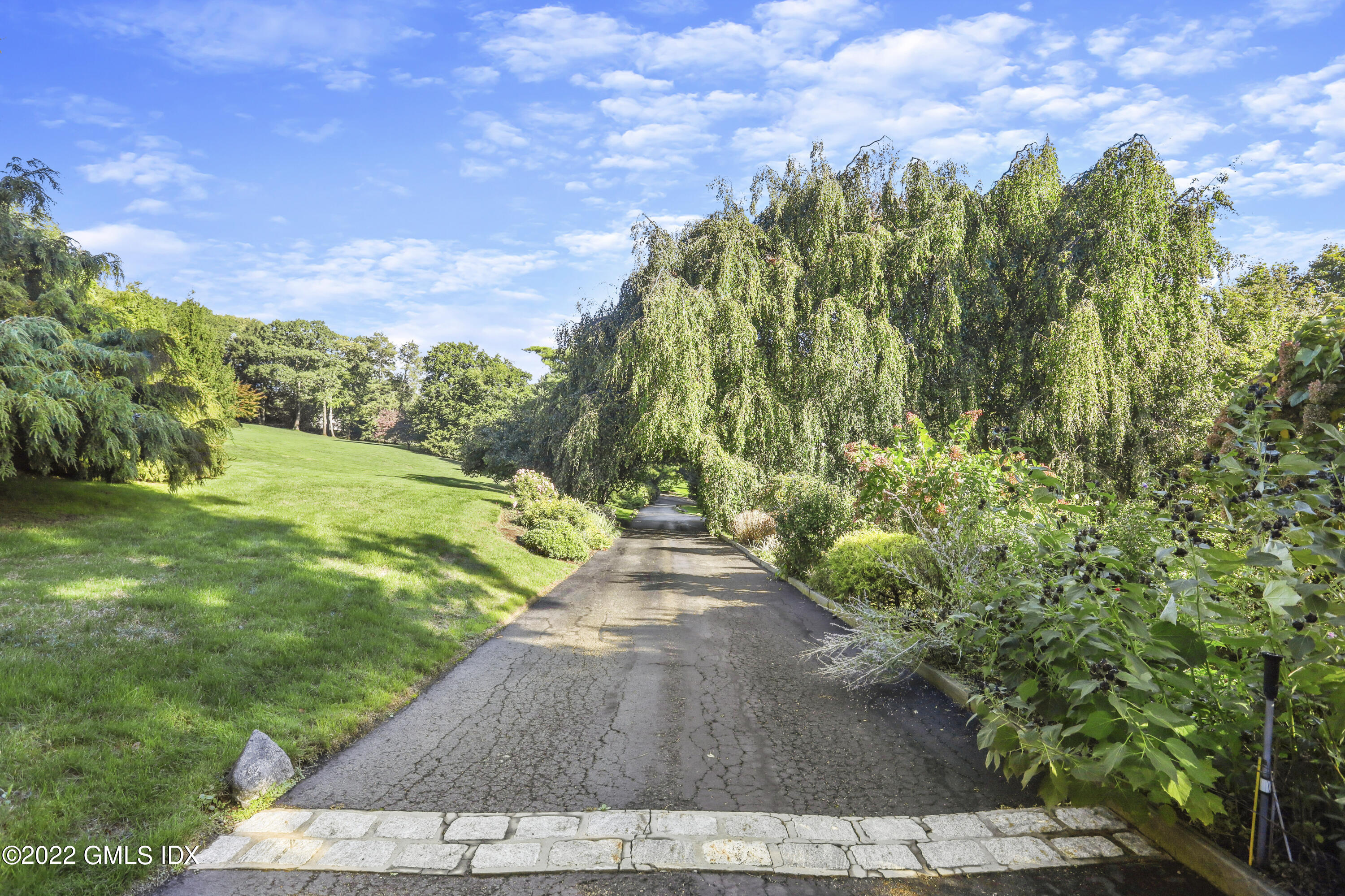 40 Doubling Road Greenwich, CT 06830 - Photo 17 of 21 a view of a yard with an trees