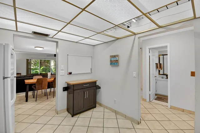a kitchen with a stove a refrigerator and a sink