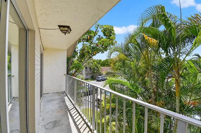 a balcony with wooden floor