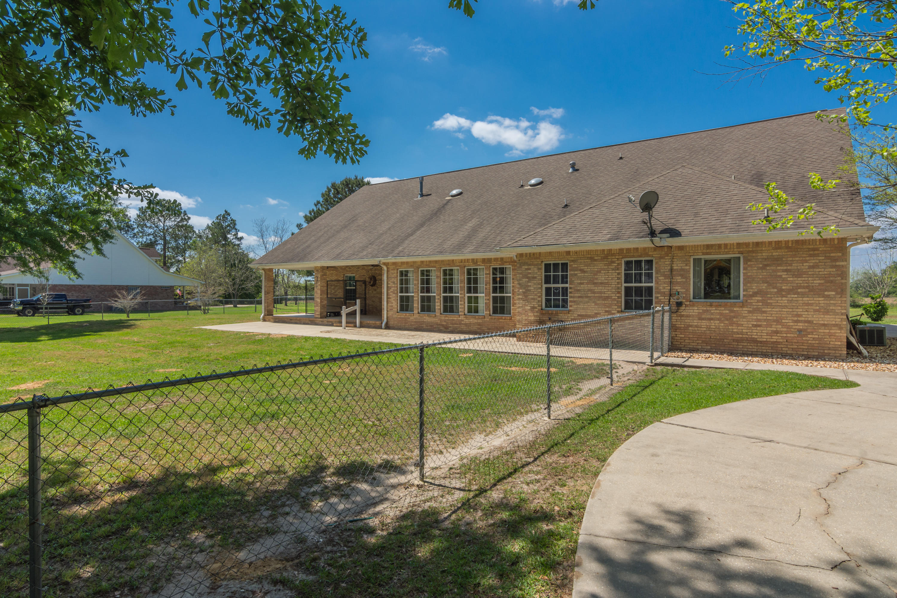 5995 Jack Stokes Road Baker, FL 32531 - Photo 12 of 60 a front view of a house with a yard