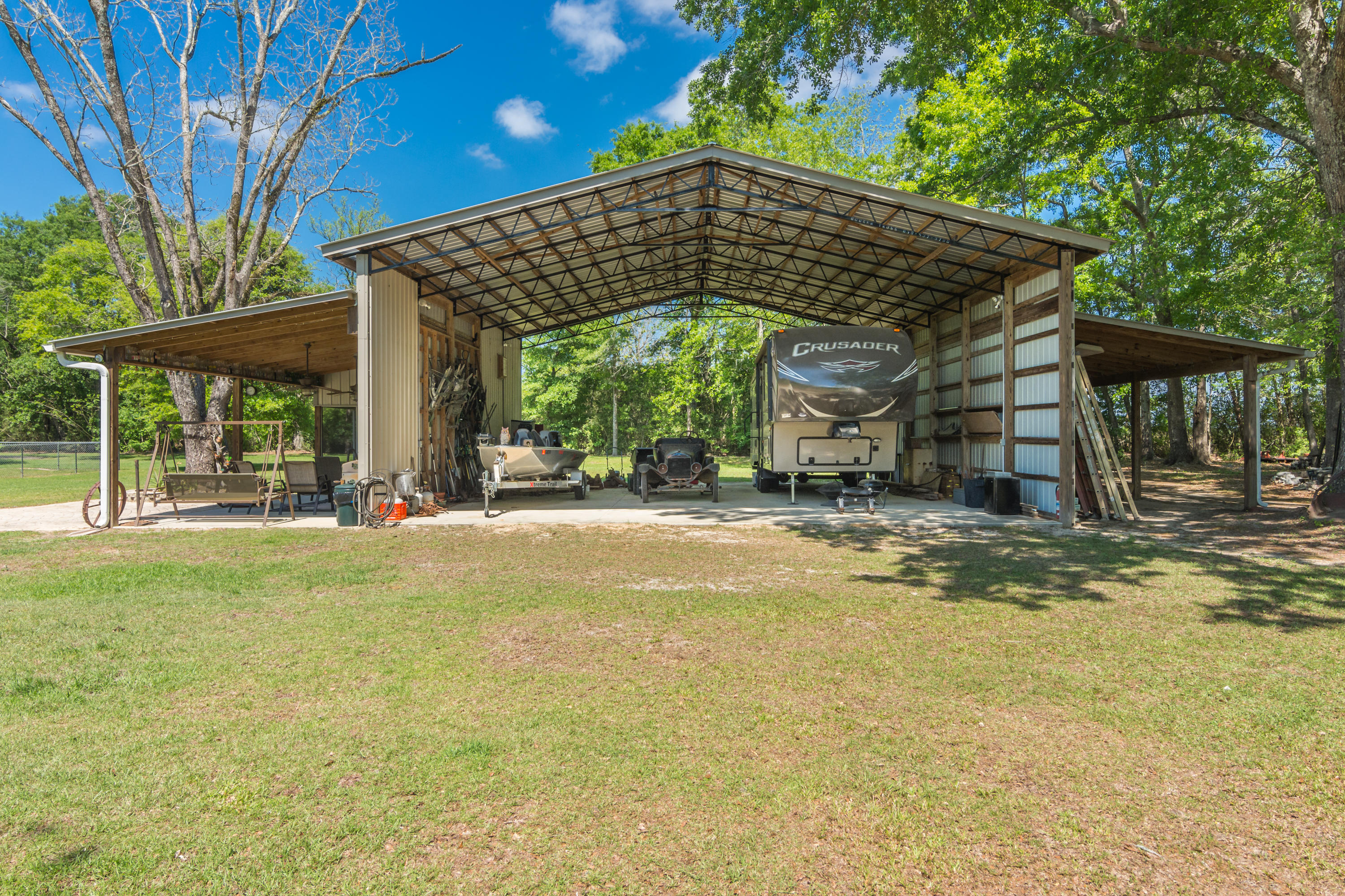 5995 Jack Stokes Road Baker, FL 32531 - Photo 14 of 60 a view of a house with a yard