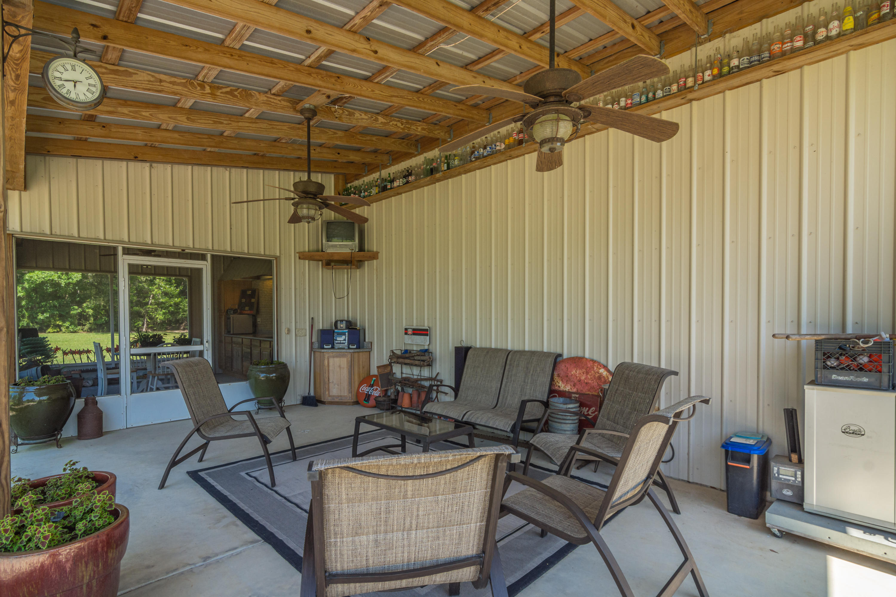 5995 Jack Stokes Road Baker, FL 32531 - Photo 19 of 60 a living room with furniture and a chandelier