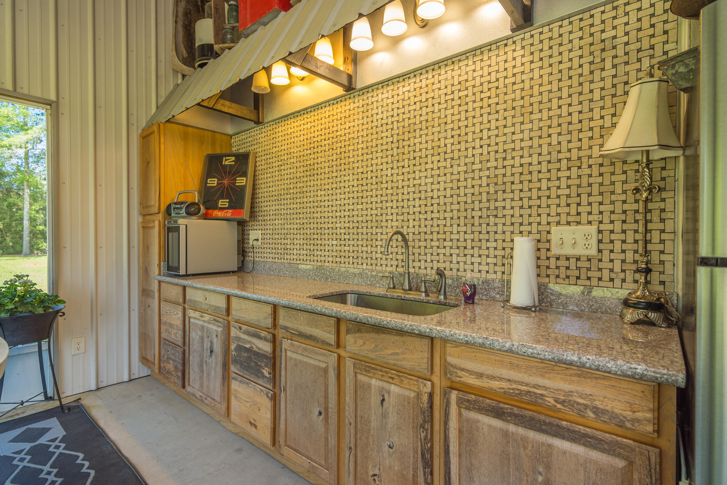 5995 Jack Stokes Road Baker, FL 32531 - Photo 22 of 60 a bathroom with a sink and a shower