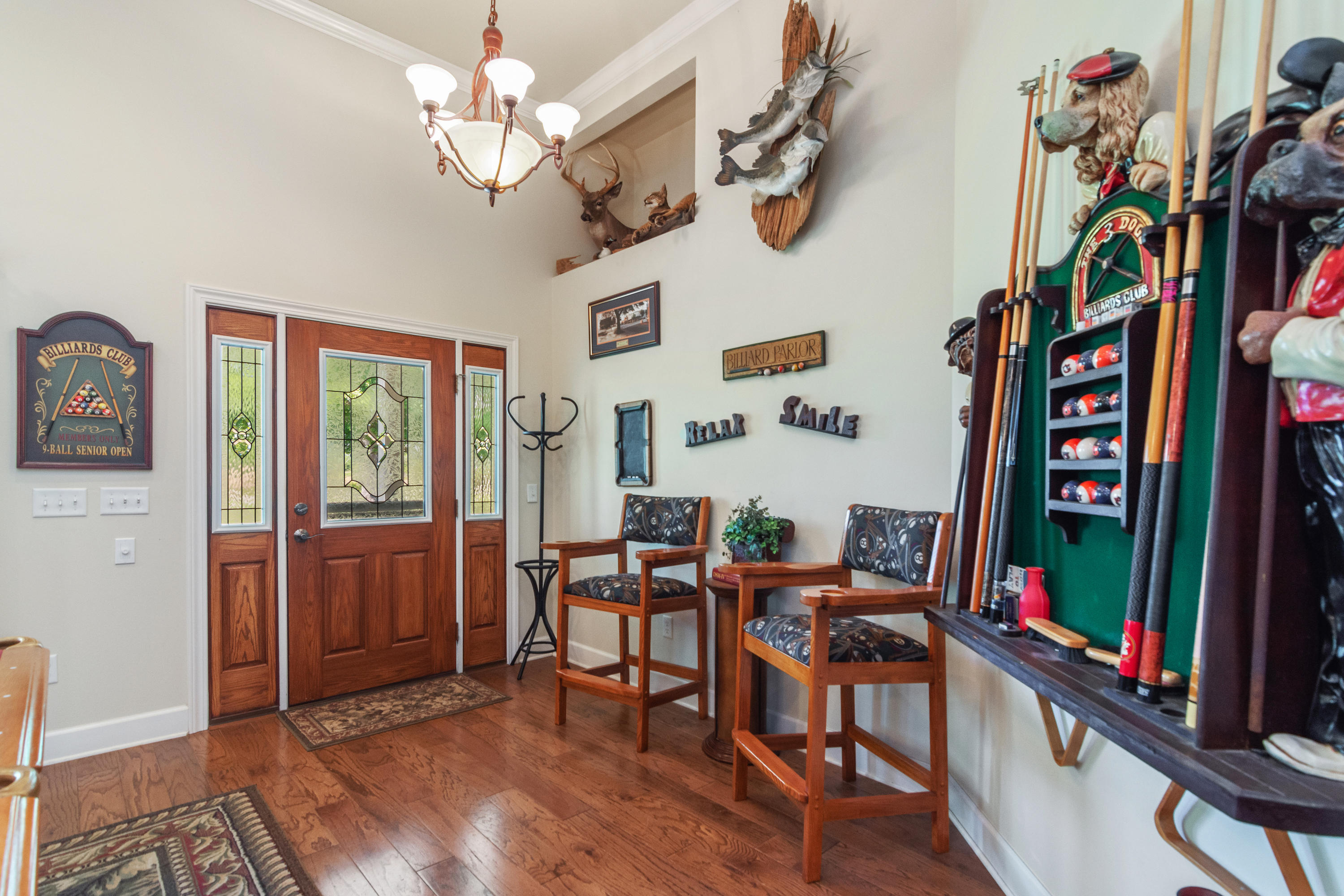 5995 Jack Stokes Road Baker, FL 32531 - Photo 23 of 60 a view of a dining room with furniture water chandelier and wooden floor