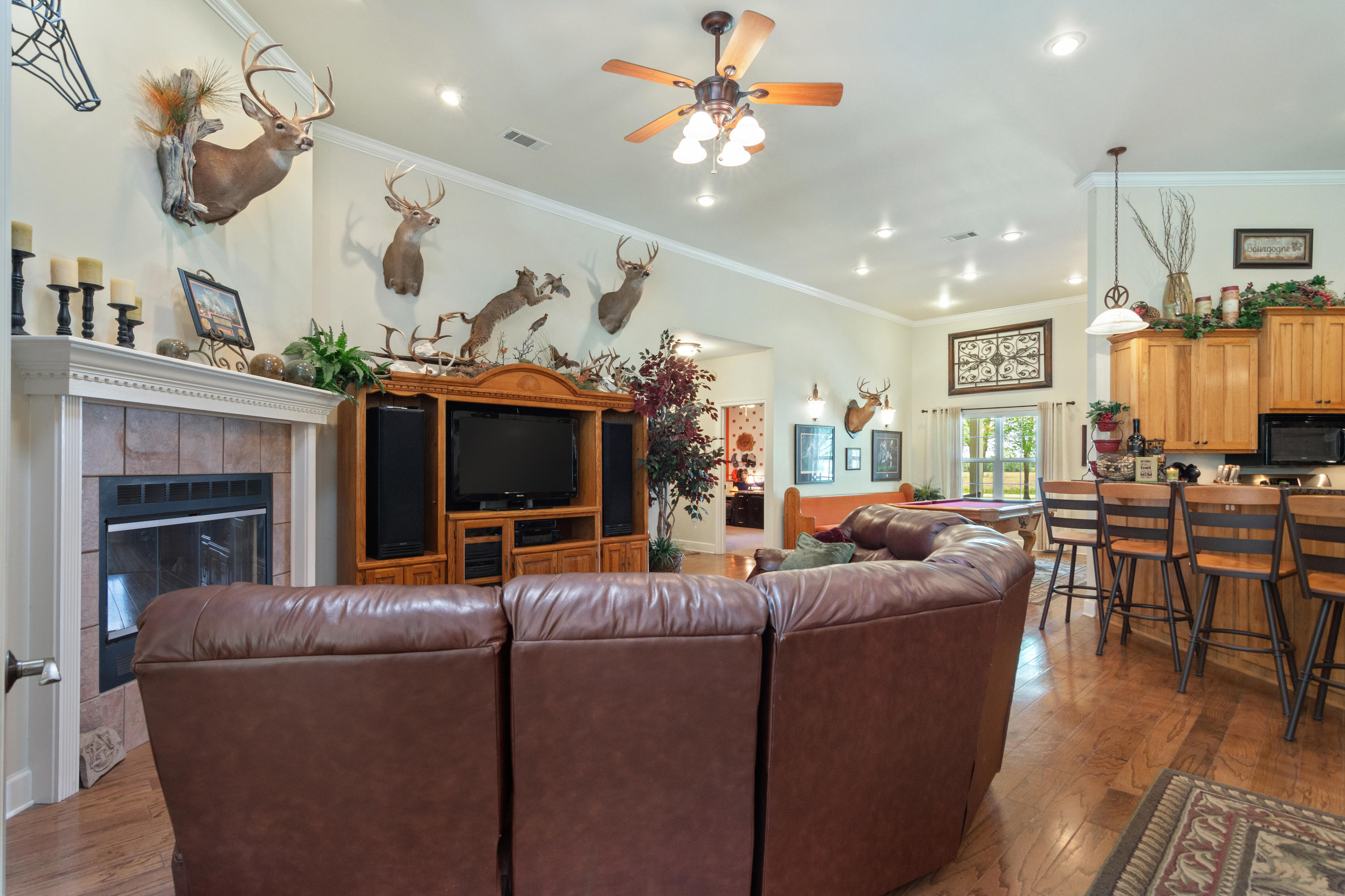 5995 Jack Stokes Road Baker, FL 32531 - Photo 26 of 60 a living room with furniture a fireplace and a flat screen tv