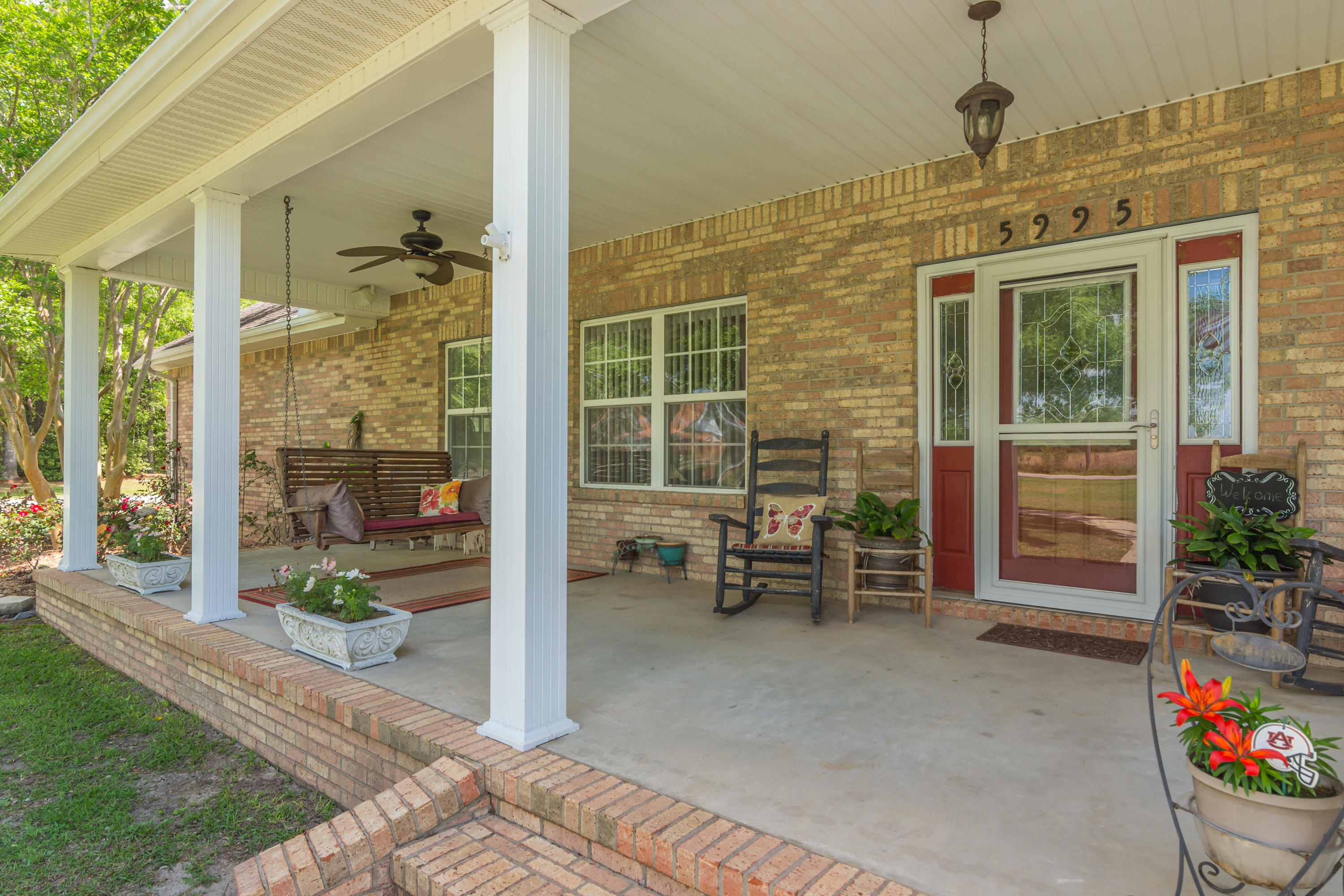 5995 Jack Stokes Road Baker, FL 32531 - Photo 4 of 60 a front view of a house with outdoor seating