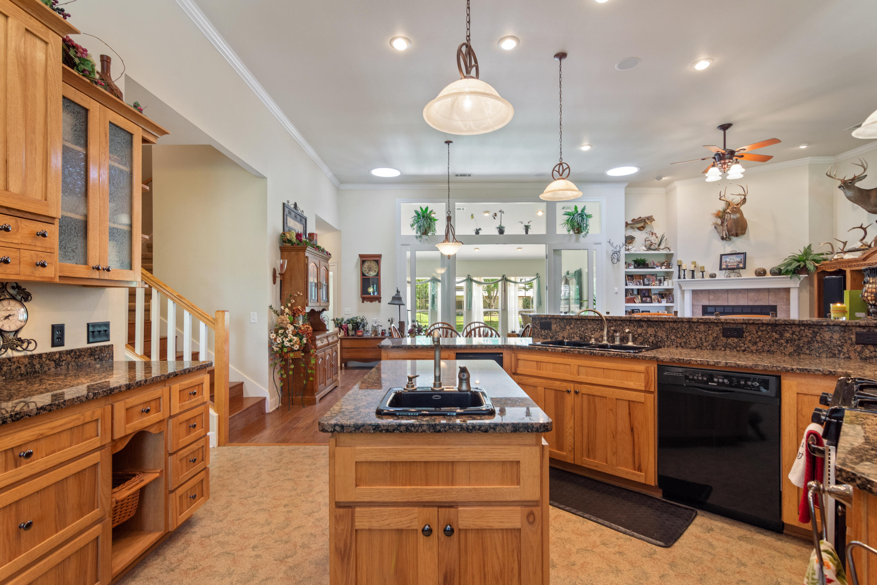 5995 Jack Stokes Road Baker, FL 32531 - Photo 32 of 60 a kitchen with stainless steel appliances granite countertop a stove a sink and a refrigerator
