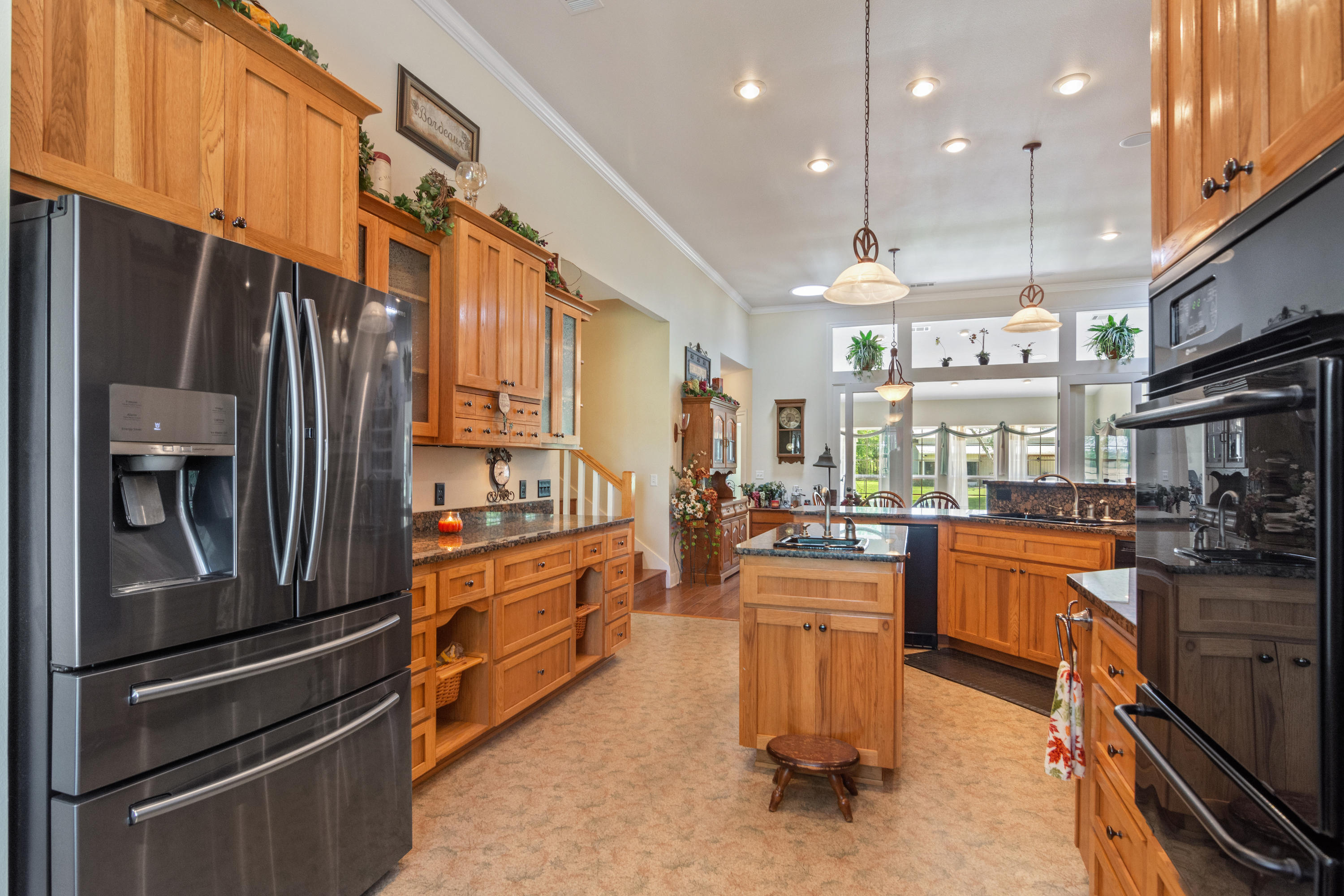 5995 Jack Stokes Road Baker, FL 32531 - Photo 33 of 60 a kitchen with a refrigerator and a stove