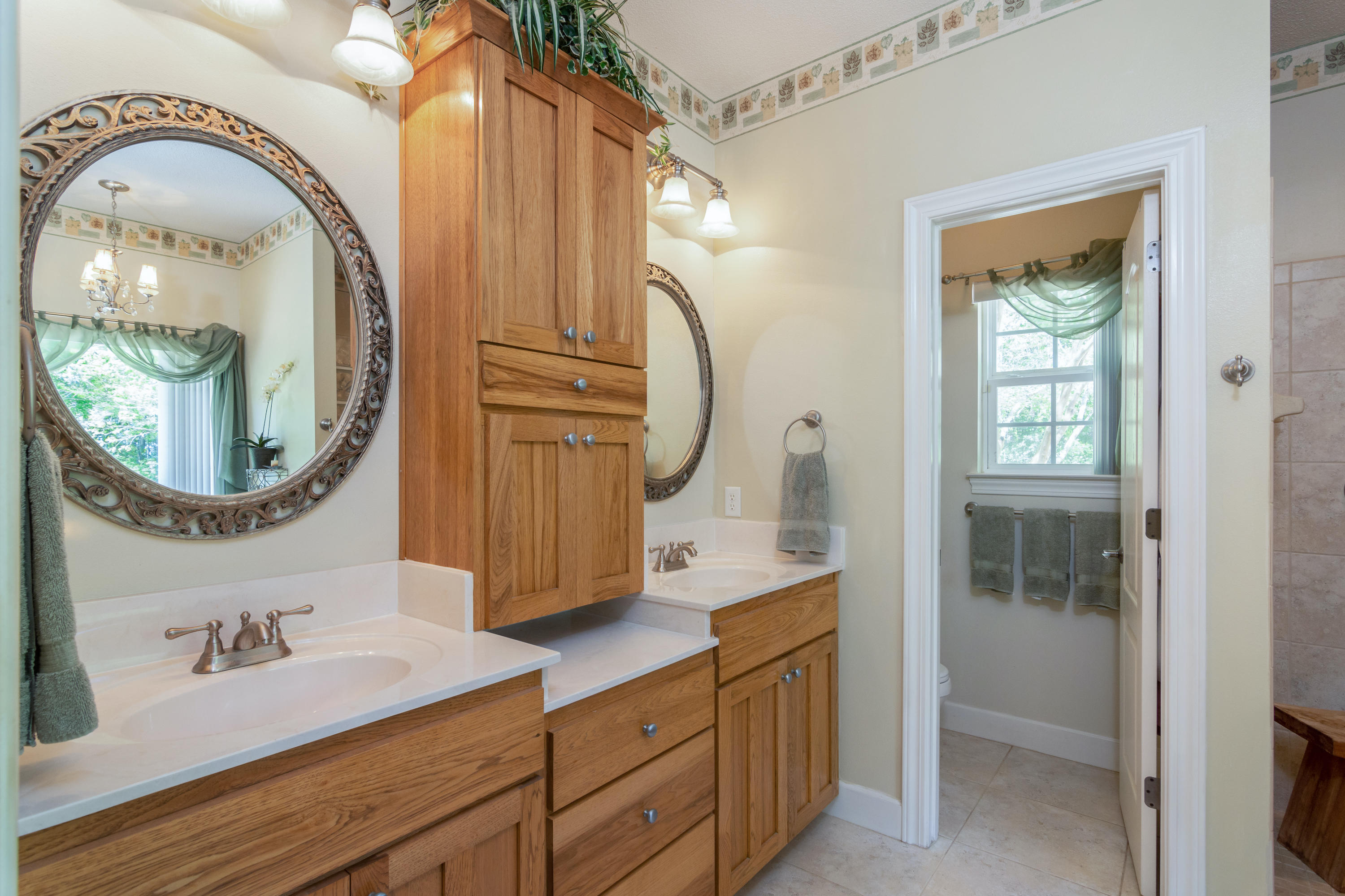 5995 Jack Stokes Road Baker, FL 32531 - Photo 38 of 60 a bathroom with a sink and a mirror