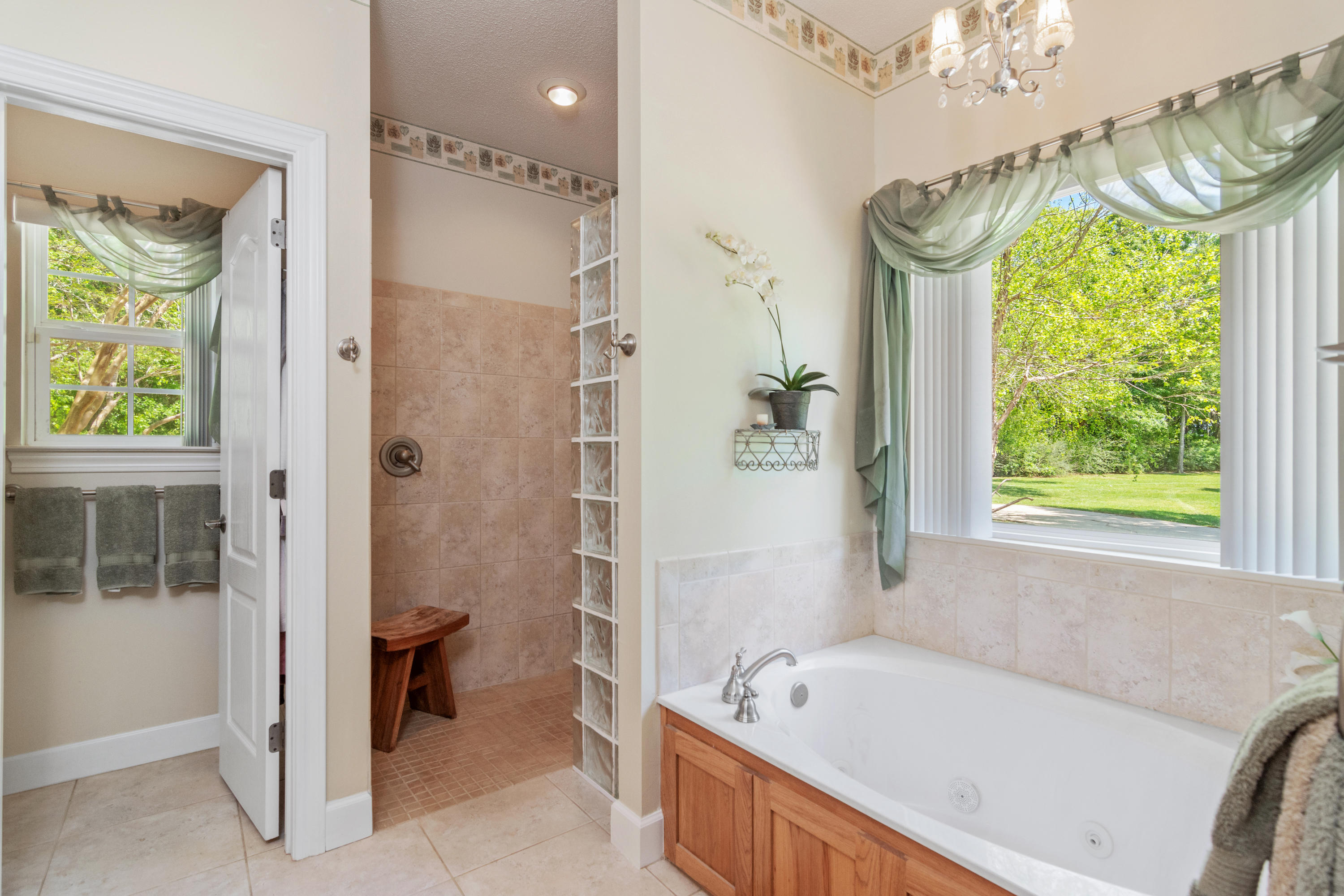 5995 Jack Stokes Road Baker, FL 32531 - Photo 39 of 60 a bathroom with a tub a sink and a window