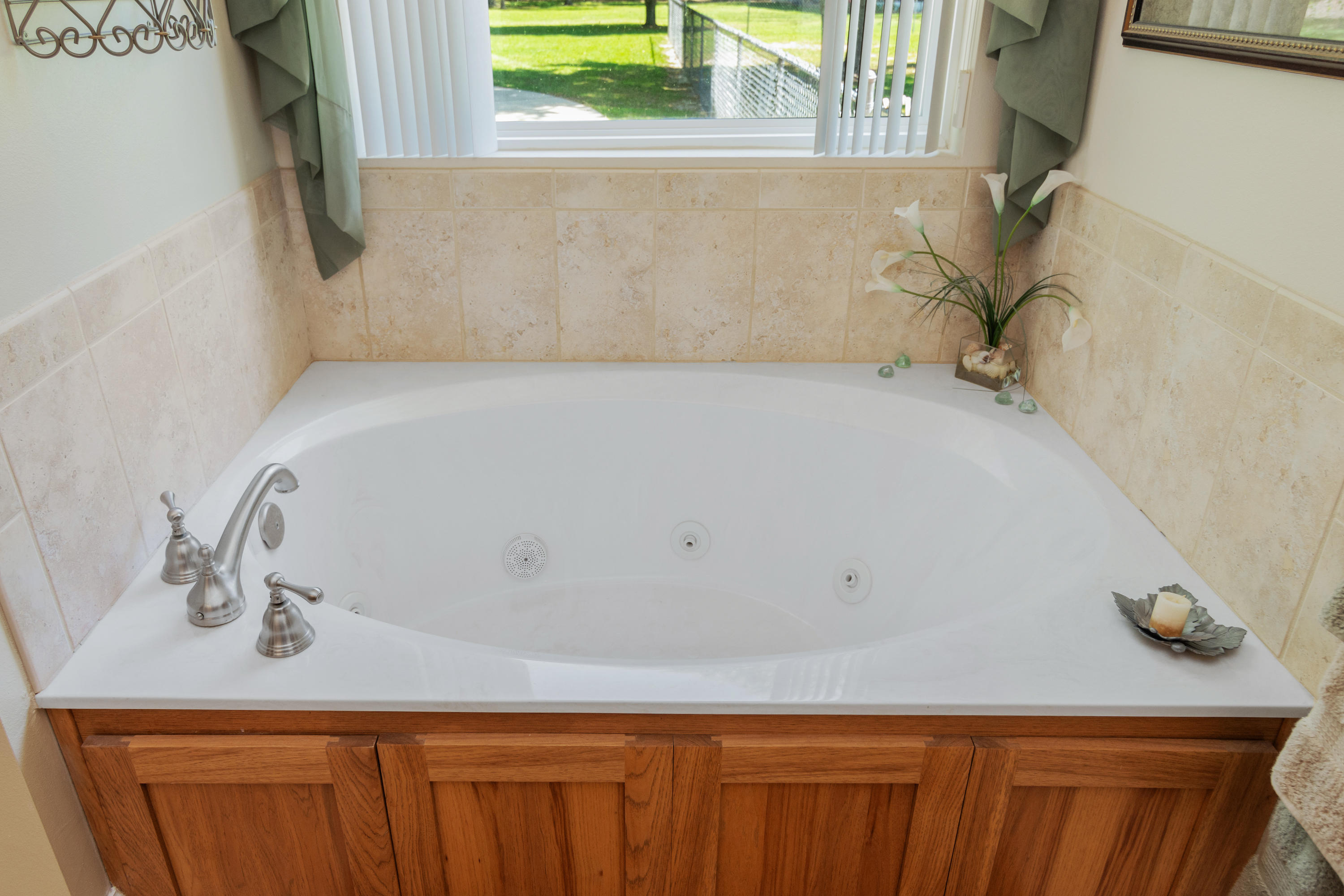 5995 Jack Stokes Road Baker, FL 32531 - Photo 40 of 60 a bathroom with a bathtub