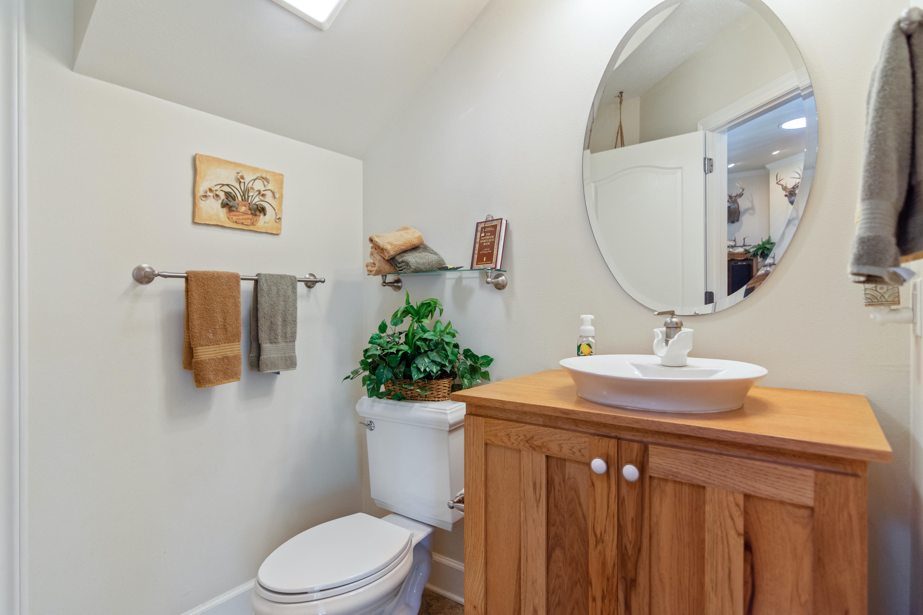 5995 Jack Stokes Road Baker, FL 32531 - Photo 43 of 60 a bathroom with a sink mirror and toilet