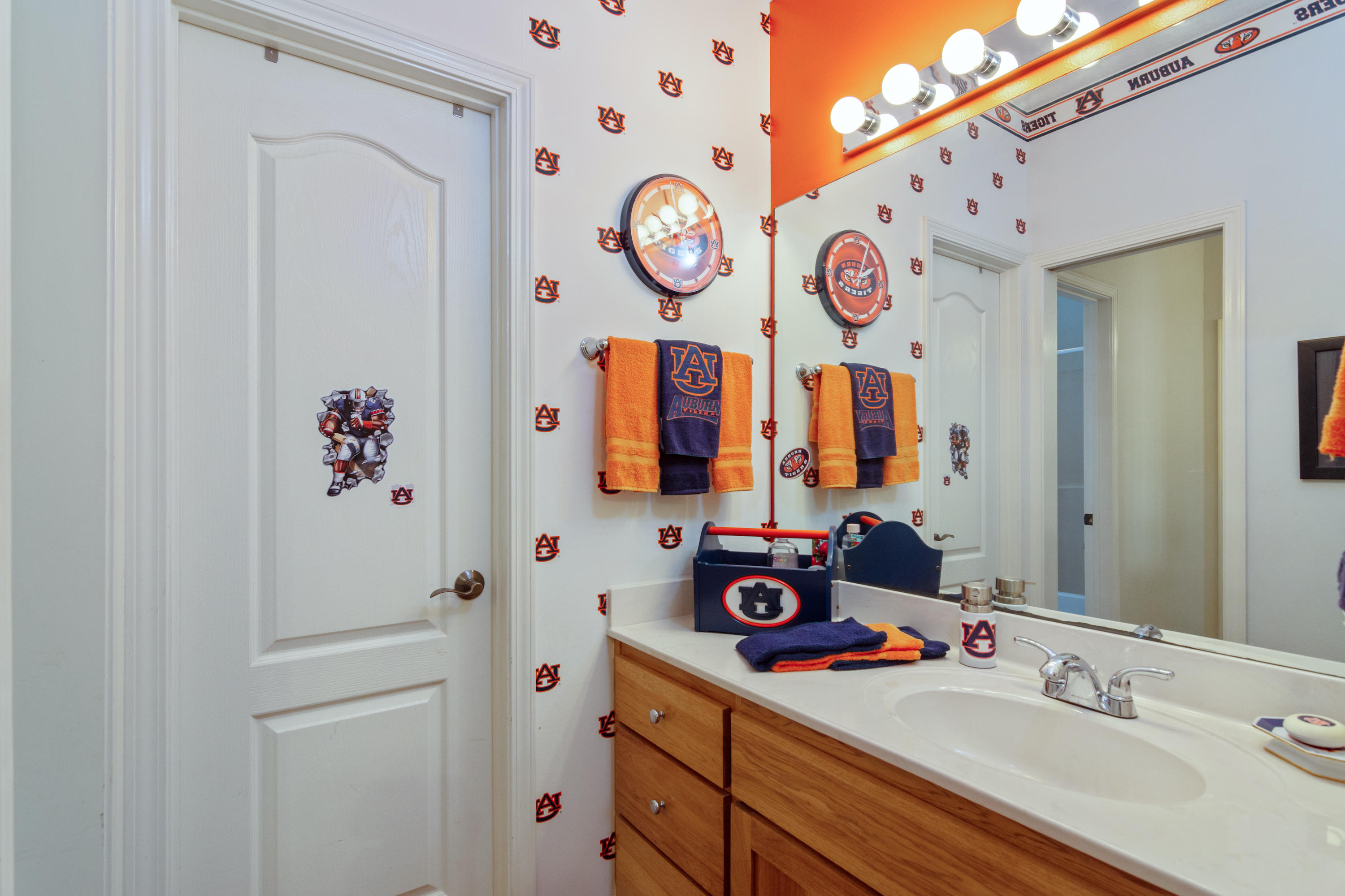 5995 Jack Stokes Road Baker, FL 32531 - Photo 45 of 60 a bathroom with a sink and a mirror