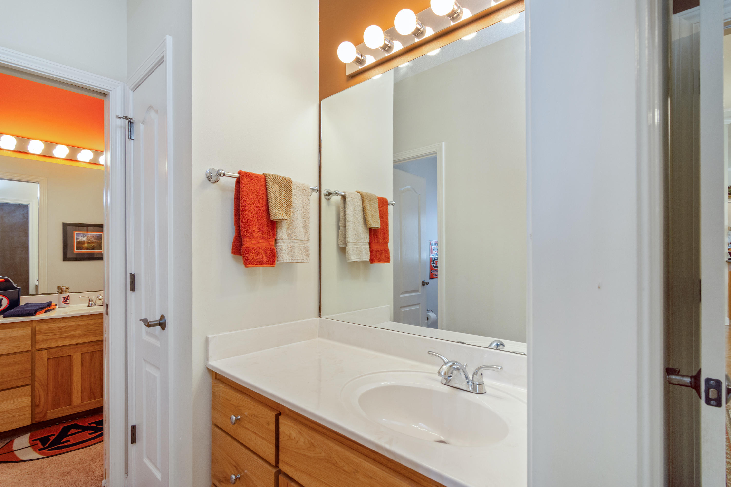 5995 Jack Stokes Road Baker, FL 32531 - Photo 47 of 60 a bathroom with a sink and a mirror