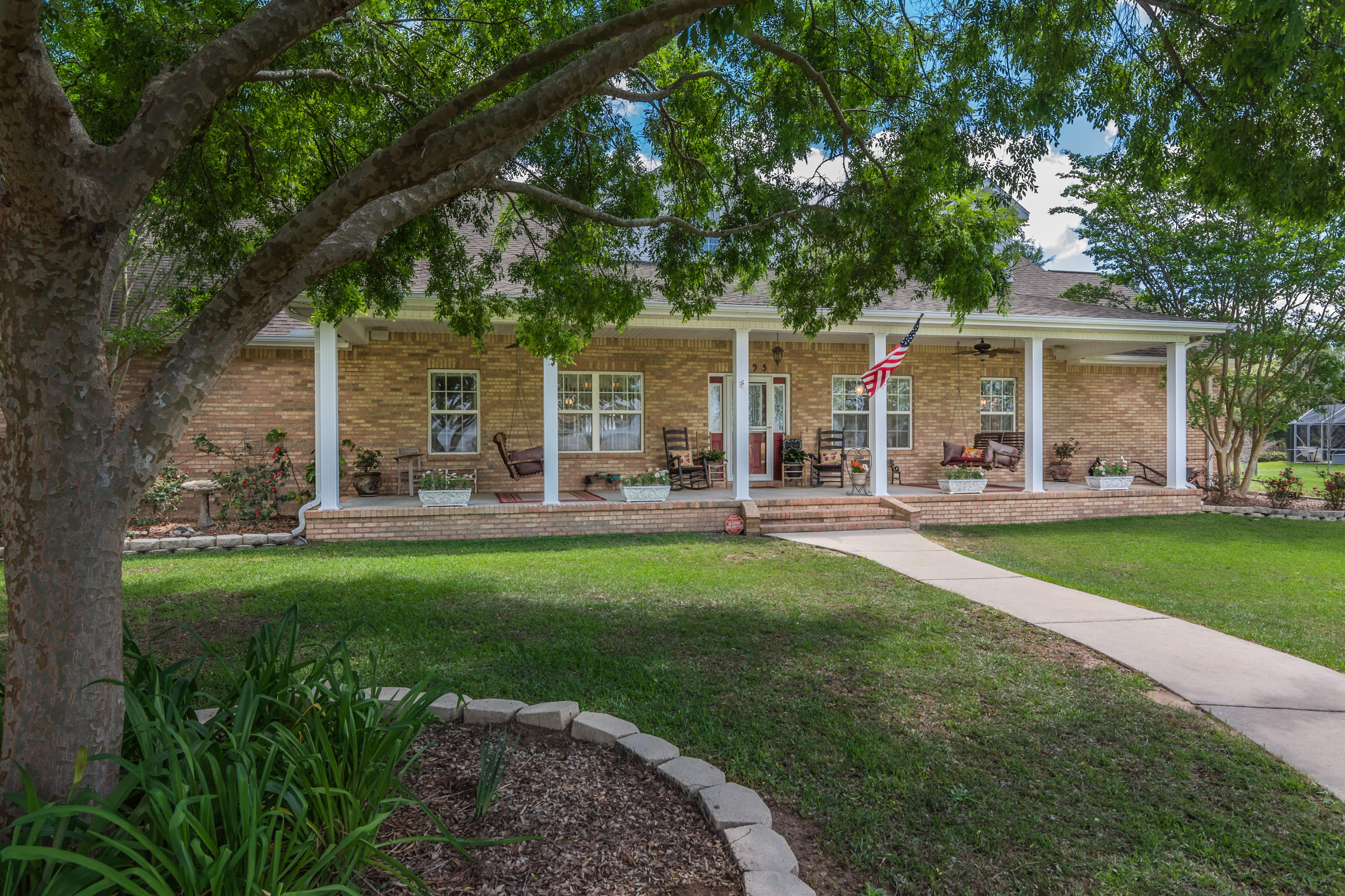 5995 Jack Stokes Road Baker, FL 32531 - Photo 6 of 60 a view of a house with backyard porch and sitting area