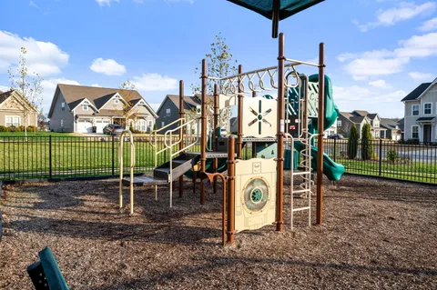 a view of a park with swings and slides