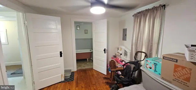 a spacious bathroom with a bathtub and a sink