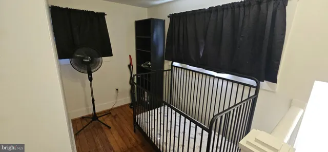 a bedroom with a bed and a dresser in it