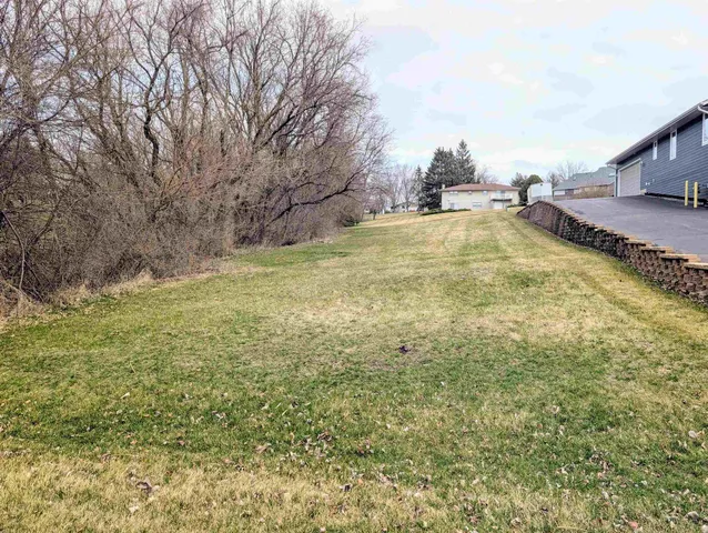 a swimming pool with some trees in the background