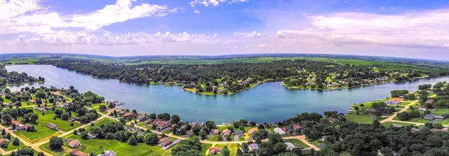 a view of a lake with a flower in a lot