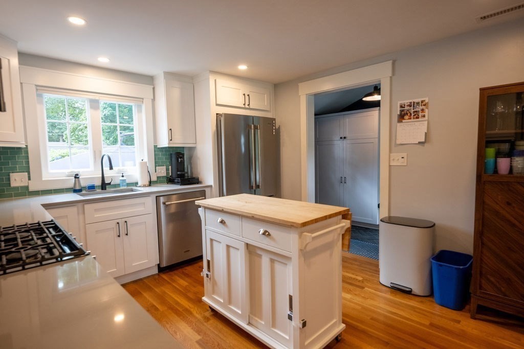 18 Belmore Road Natick, MA 01760 - Photo 16 of 30 a kitchen that has a sink a stove and a refrigerator