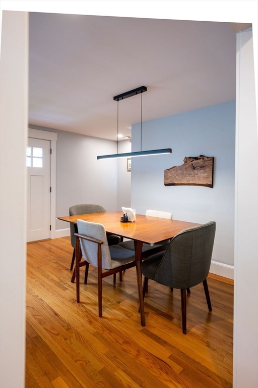 18 Belmore Road Natick, MA 01760 - Photo 21 of 30 a view of a dining room with furniture and wooden floor
