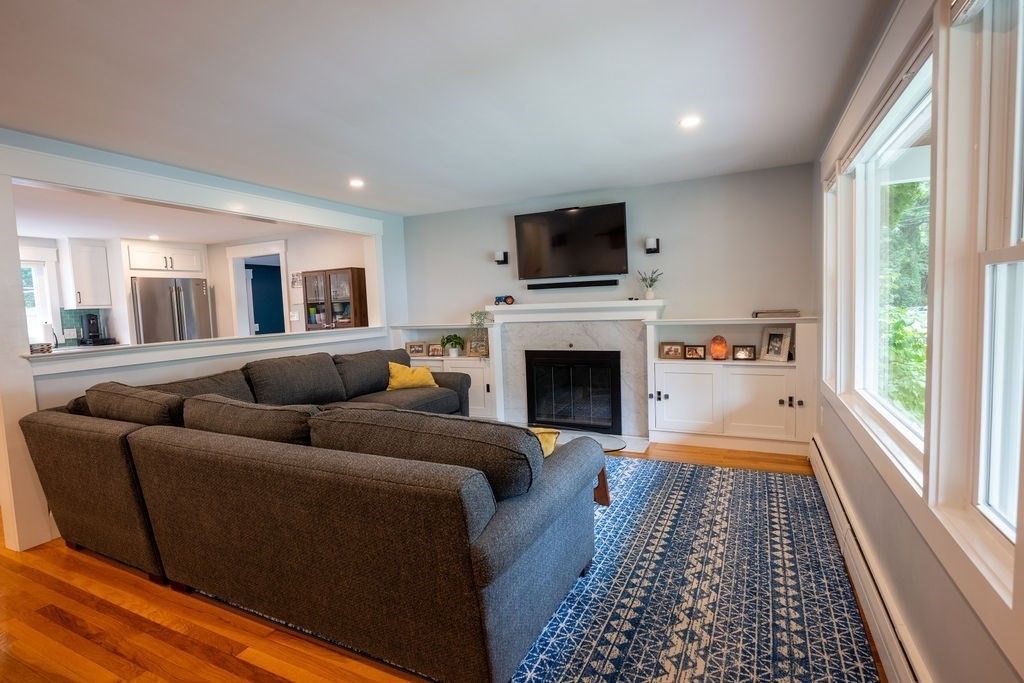 18 Belmore Road Natick, MA 01760 - Photo 24 of 30 a living room with furniture fireplace and flat screen tv