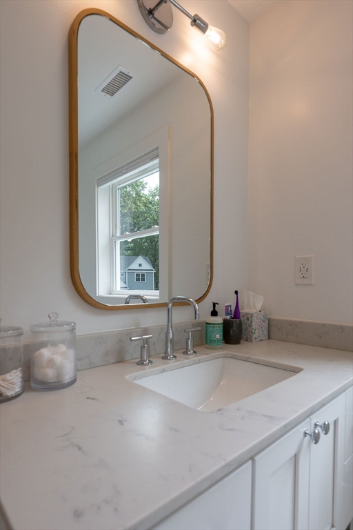 18 Belmore Road Natick, MA 01760 - Photo 27 of 30 a bathroom with a sink and a mirror