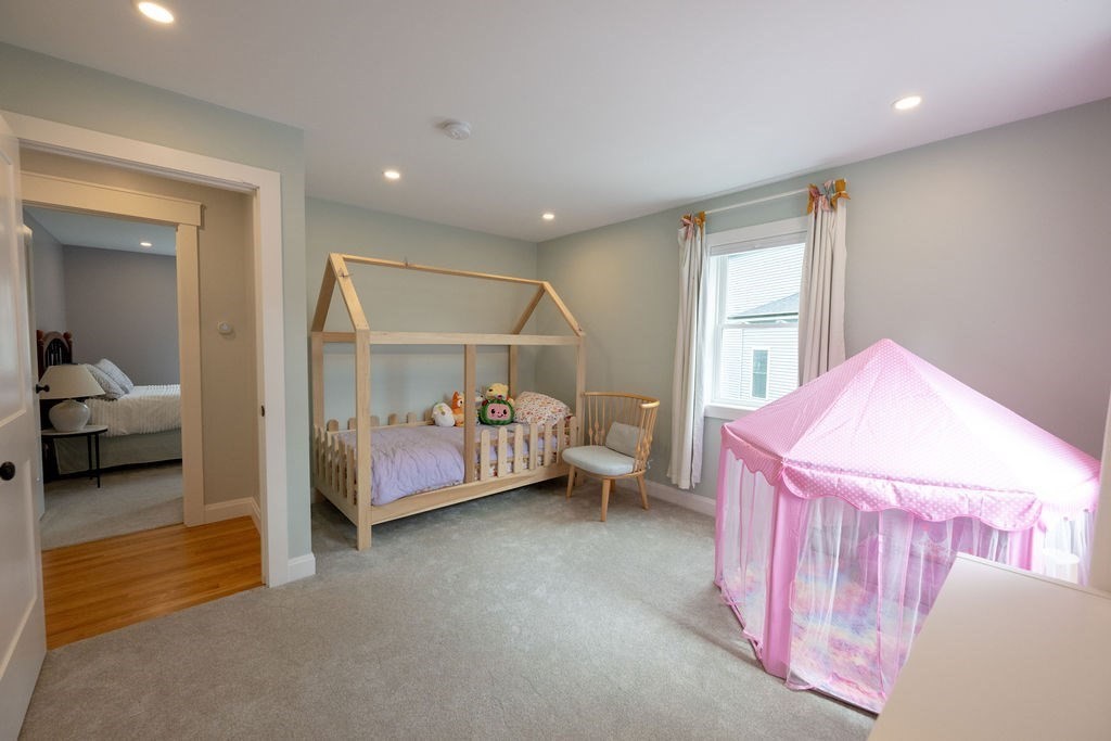18 Belmore Road Natick, MA 01760 - Photo 28 of 30 a bedroom with a bed and a window